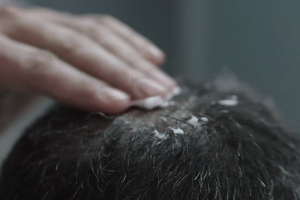 Regaine for Men foam being massaged into scalp