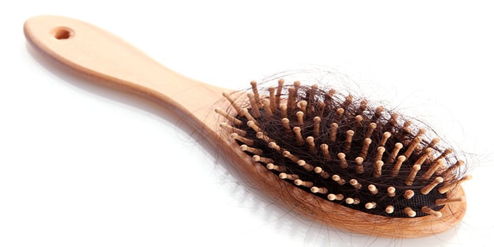 Hair brush with hair in it